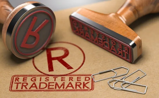 setting up a company in dubai - Two rubber stamps with 'B' and 'Trademark' next to a 'Registered Trademark' stamp on paper.
